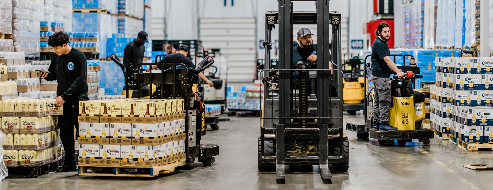 Employees working at VWB Warehouse with forklift